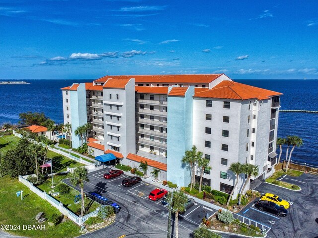 view of building exterior with a water view