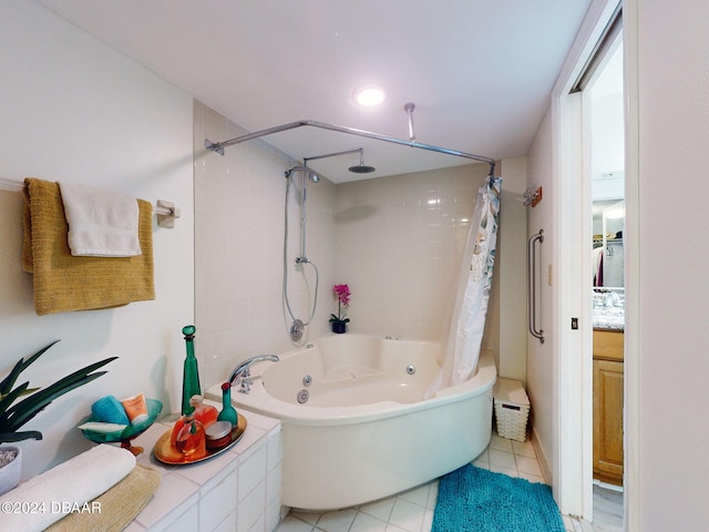 bathroom featuring vanity, tile patterned floors, and shower / bath combo with shower curtain