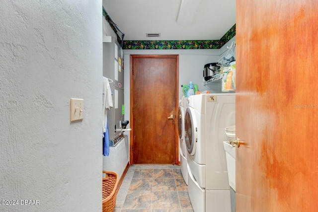 washroom with separate washer and dryer