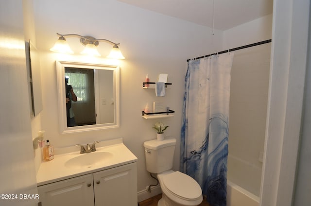 full bathroom with vanity, shower / bath combination with curtain, and toilet