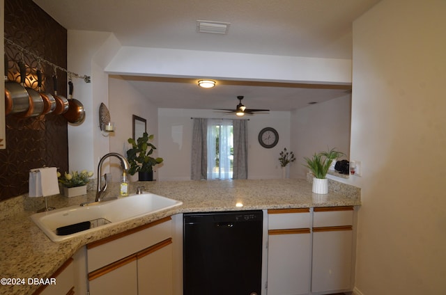 kitchen featuring light stone counters, dishwasher, kitchen peninsula, sink, and white cabinetry