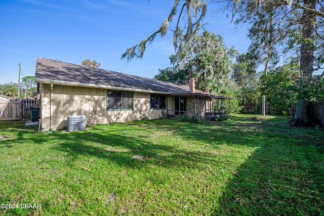500 Sandy Oaks Blvd, Ormond Beach, FL 32174 - back of property with central AC unit and a sunroom