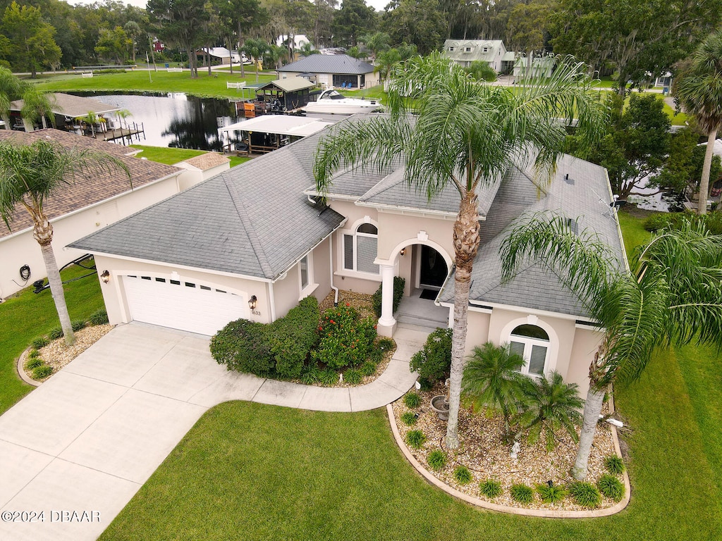 birds eye view of property with a water view