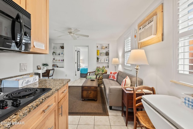 kitchen featuring light brown cabinets, ceiling fan, light tile patterned floors, and black appliances