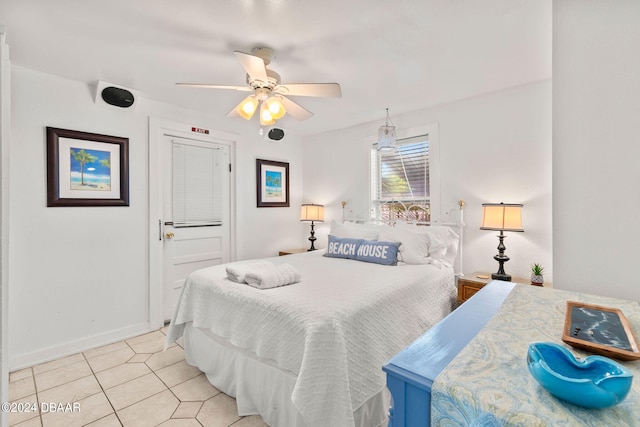 tiled bedroom with ceiling fan