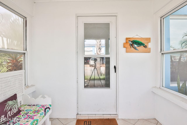 entryway featuring light tile patterned floors