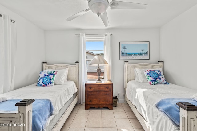 tiled bedroom featuring ceiling fan