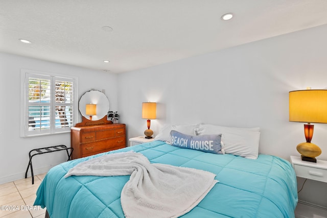 bedroom with light tile patterned floors