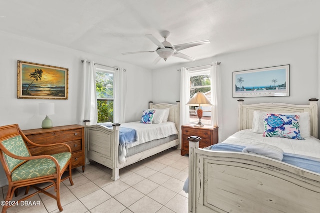 bedroom featuring light tile patterned floors and ceiling fan