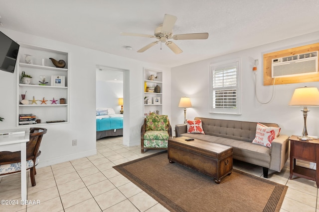 tiled living room featuring built in features, a wall mounted AC, and ceiling fan