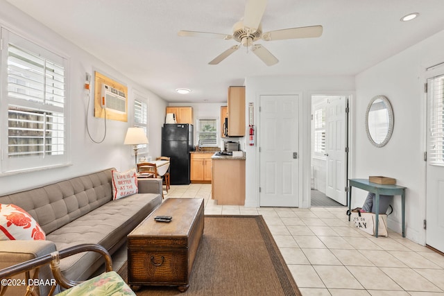 tiled living room with an AC wall unit, a wealth of natural light, and ceiling fan