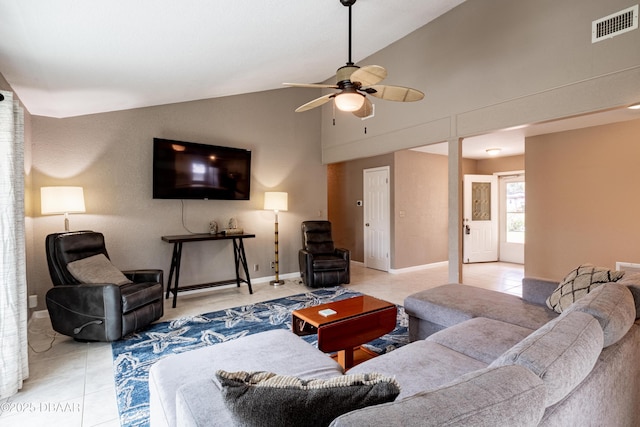 tiled living room with ceiling fan and lofted ceiling