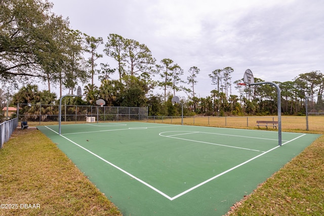 view of basketball court featuring a lawn