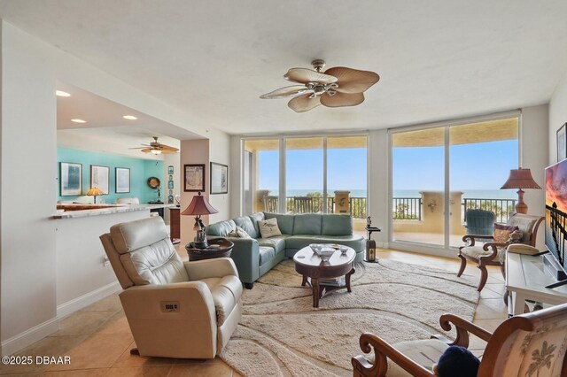20 Porto Mar Unit 302, Palm Coast, FL 32137 - living area featuring a ceiling fan, light tile patterned flooring, and recessed lighting