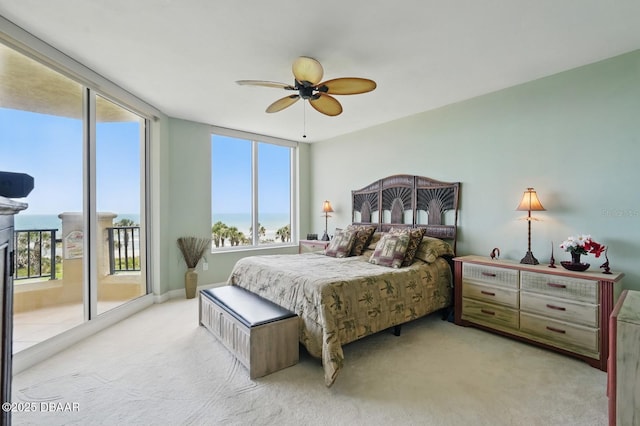 20 Porto Mar Unit 302, Palm Coast, FL 32137 - carpeted bedroom with access to exterior, multiple windows, and ceiling fan