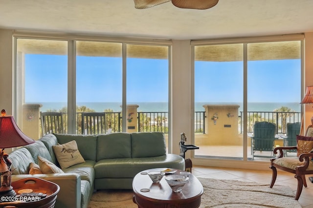 20 Porto Mar Unit 302, Palm Coast, FL 32137 - living room featuring a water view, light tile patterned floors, and ceiling fan