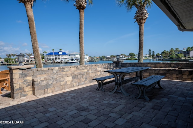 view of patio / terrace featuring a water view