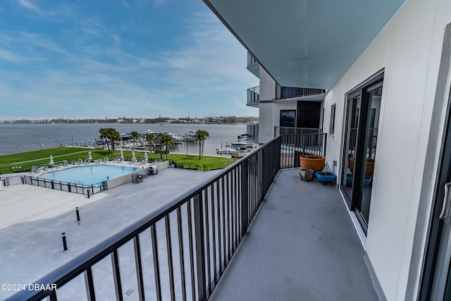 balcony featuring a water view