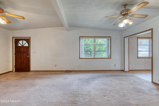 interior space featuring lofted ceiling with beams, ceiling fan, and light carpet