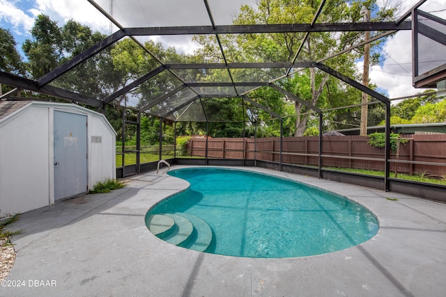 view of swimming pool featuring a storage shed and a patio