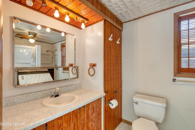 bathroom featuring vanity, ceiling fan, toilet, and walk in shower