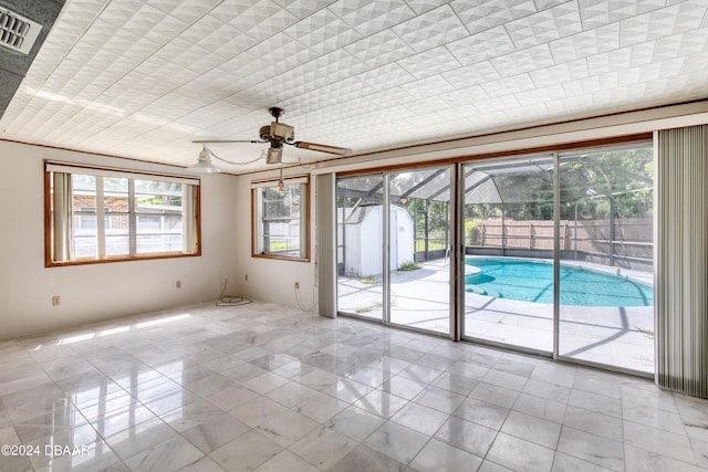 unfurnished room featuring ceiling fan