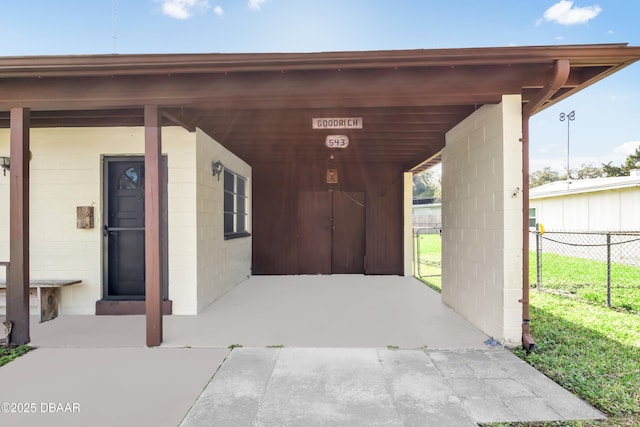 property entrance with a carport