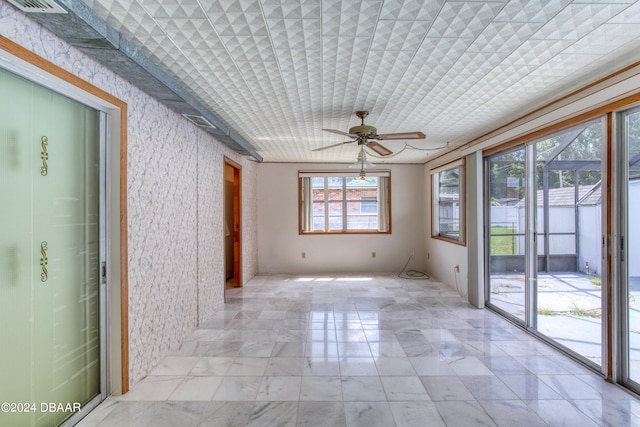 interior space featuring ceiling fan