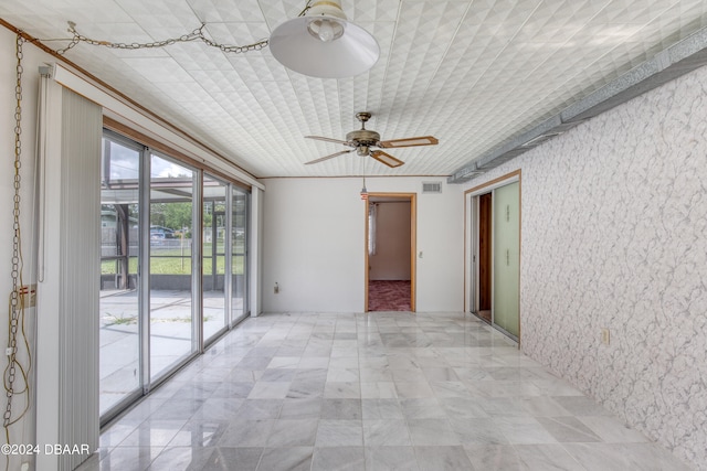 spare room with ceiling fan