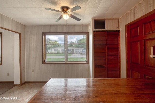 interior space featuring tile patterned flooring and ceiling fan