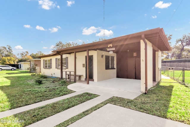 single story home with a patio area and a front yard