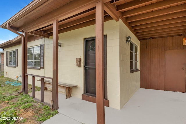 property entrance with a patio