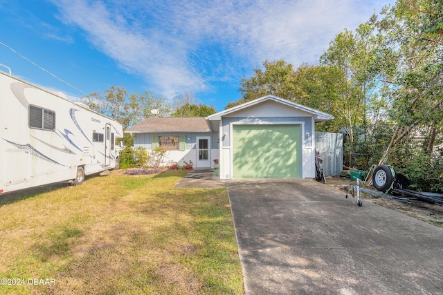 view of front of property featuring a front lawn and a garage