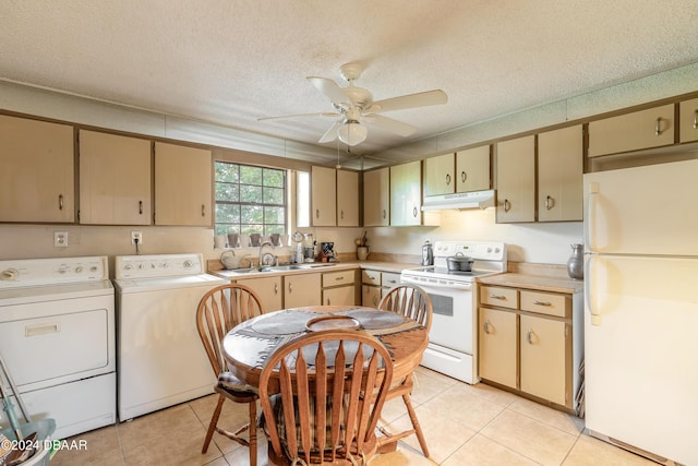 kitchen featuring a textured ceiling, white appliances, ceiling fan, sink, and separate washer and dryer