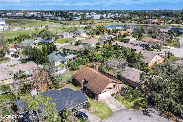 aerial view featuring a water view and a residential view