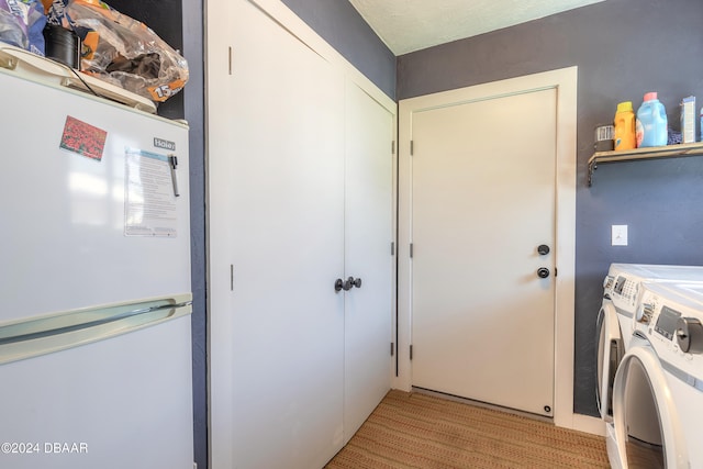 clothes washing area with independent washer and dryer