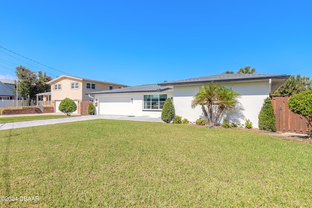 ranch-style home with a garage and a front yard