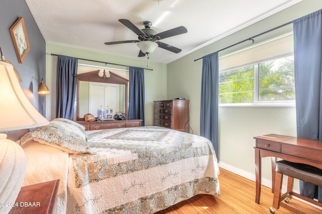 bedroom featuring hardwood / wood-style floors and ceiling fan