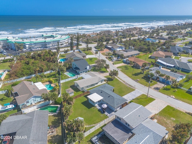 bird's eye view featuring a view of the beach and a water view