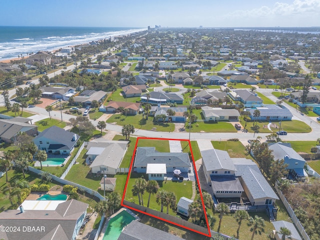 aerial view featuring a view of the beach and a water view