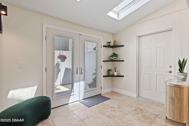 208 Pine Cone Trl, Ormond Beach, FL 32174 - doorway to outside featuring french doors, a skylight, lofted ceiling, light tile patterned floors, and baseboards