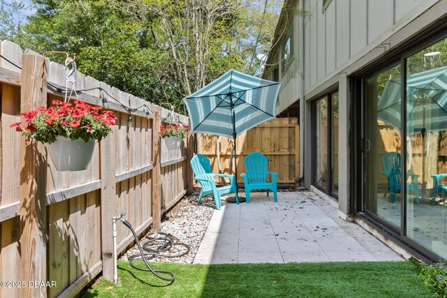 208 Pine Cone Trl, Ormond Beach, FL 32174 - fenced backyard with a patio