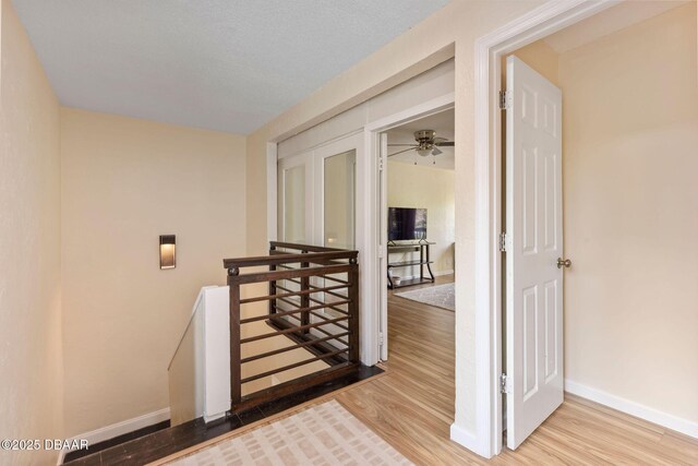 208 Pine Cone Trl, Ormond Beach, FL 32174 - stairway with wood finished floors and baseboards