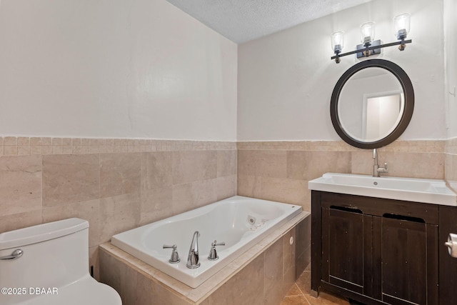 208 Pine Cone Trl, Ormond Beach, FL 32174 - full bath with a tub with jets, vanity, a textured ceiling, toilet, and tile walls