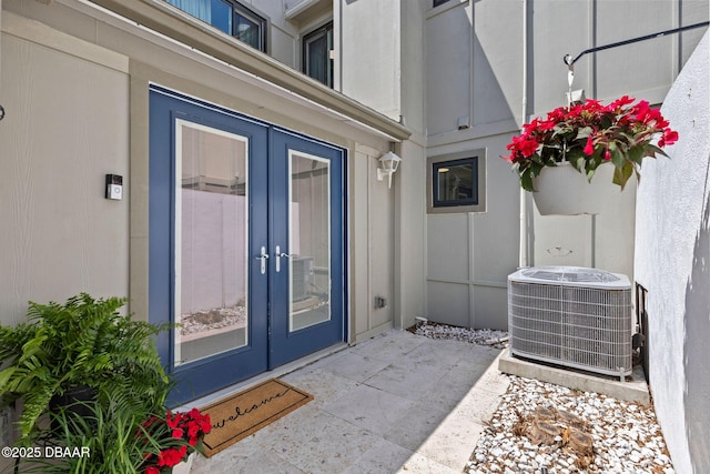 208 Pine Cone Trl, Ormond Beach, FL 32174 - property entrance featuring french doors and central AC
