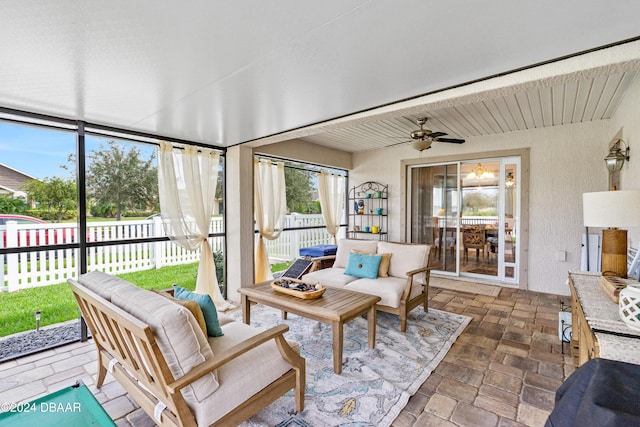 sunroom / solarium with ceiling fan