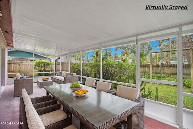 sunroom / solarium with vaulted ceiling