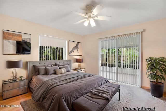 bedroom with access to outside, ceiling fan, and light hardwood / wood-style floors