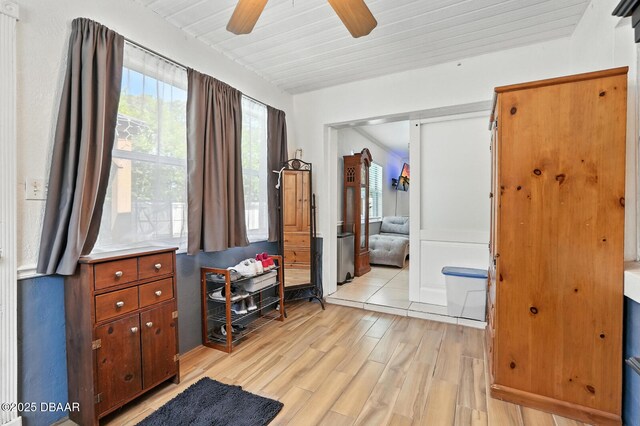 1720 Hope Dr, Ormond Beach, FL 32174 - bedroom featuring light wood-style flooring, a closet, and a ceiling fan