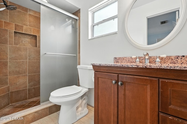 1720 Hope Dr, Ormond Beach, FL 32174 - bathroom with a shower stall, vanity, and tile patterned flooring